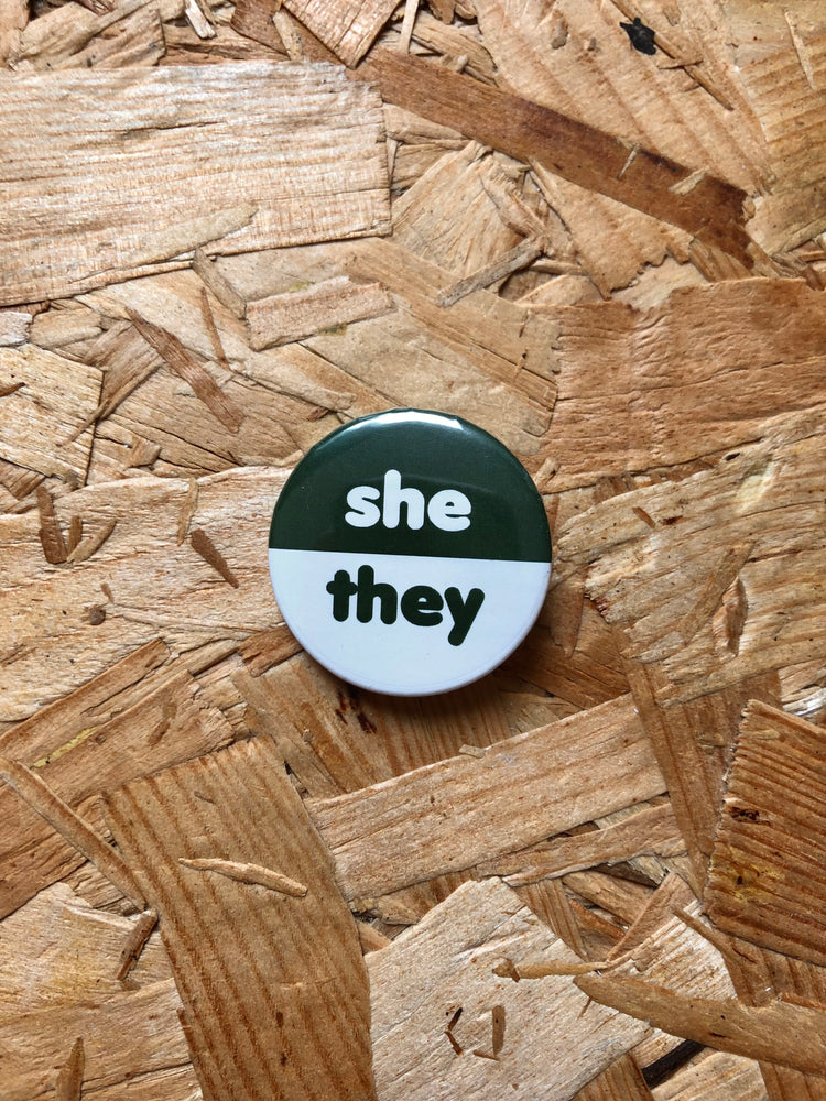 
            
                Load image into Gallery viewer, She/They Two-Tone Pronoun Badges 32mm
            
        